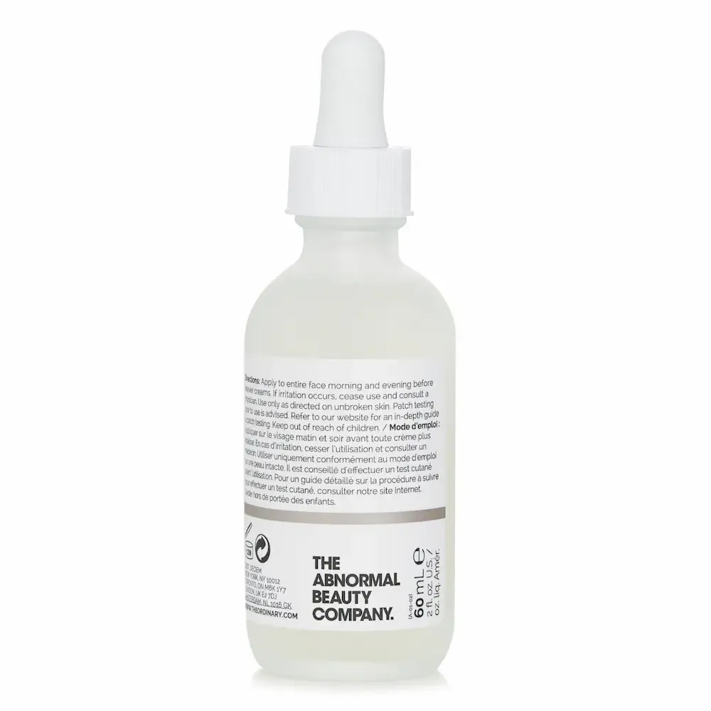 A 60 ml dropper bottle from The Ordinary, turned so the directions panel on the back faces out.