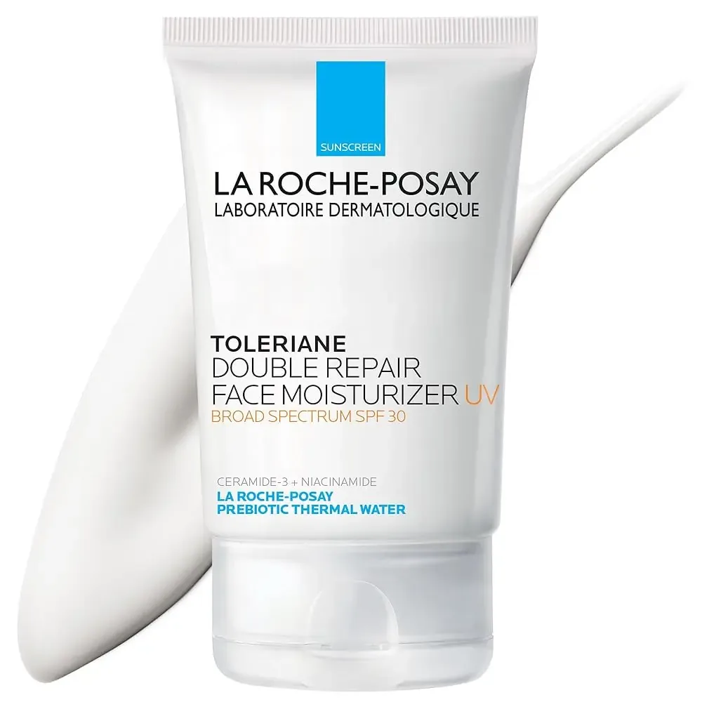 A tube of La Roche-Posay Toleriane Double Repair Face Moisturizer UV, broad spectrum SPF 30, with a swatch of white cream behind it.