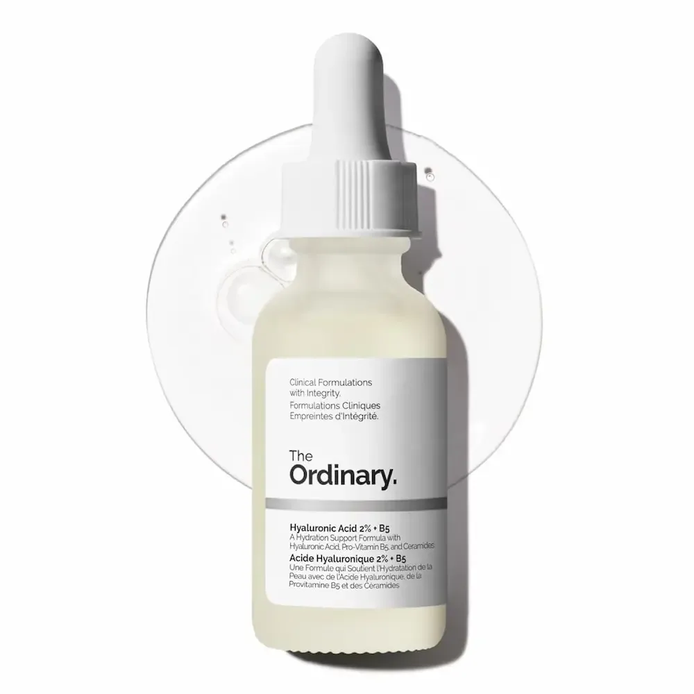 A dropper bottle of The Ordinary Hyaluronic Acid 2% plus B5, on a clear circle of gel.